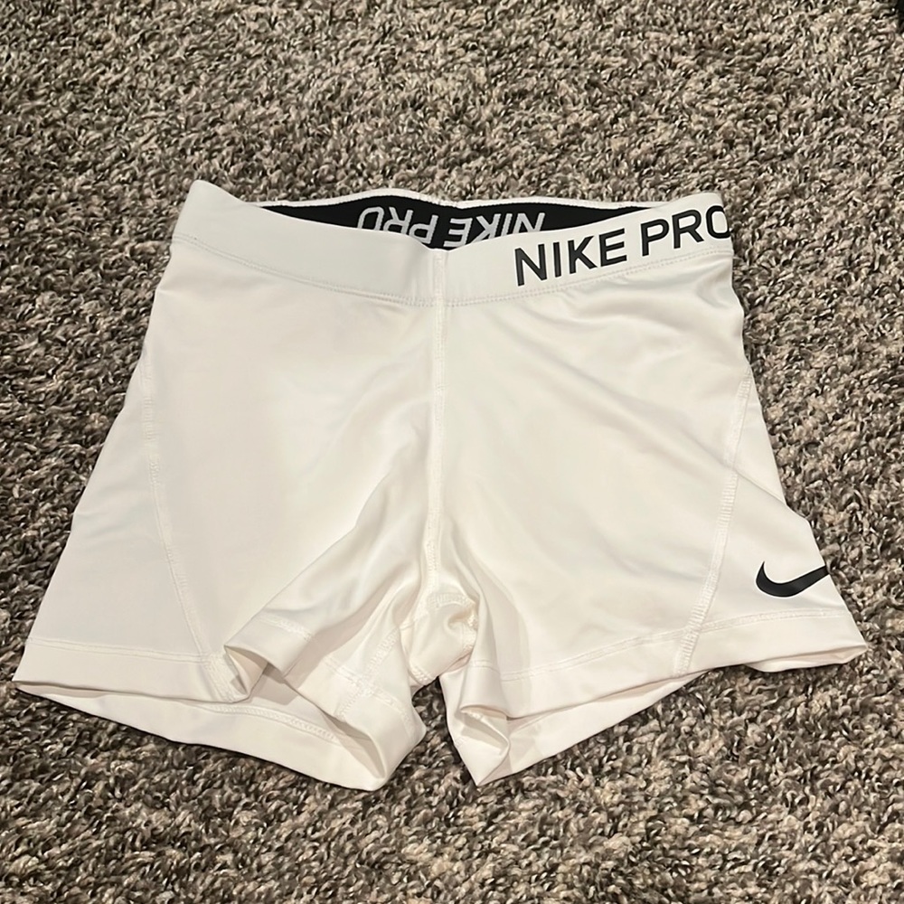 White Nike Pros.